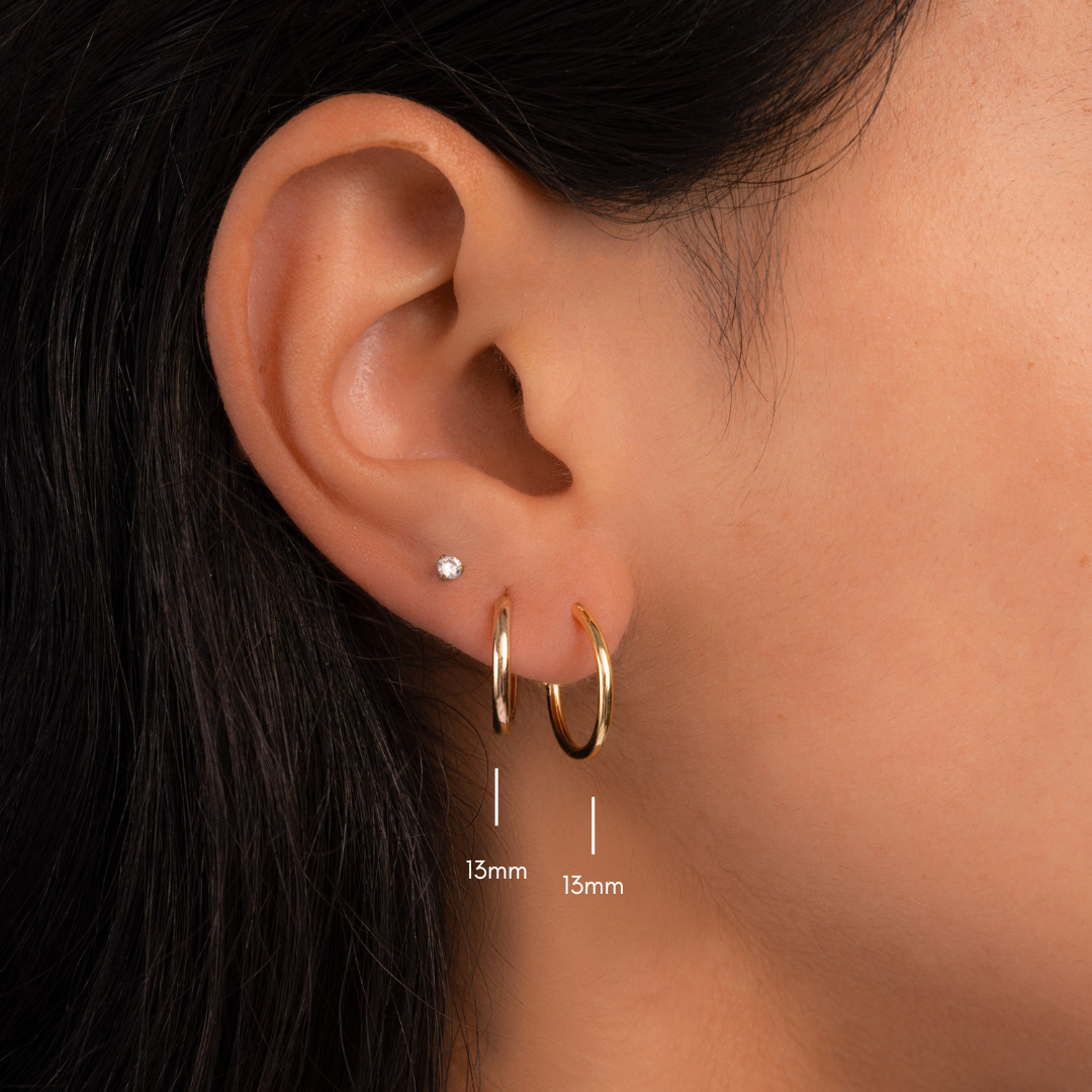 model wearing 13mm huggie hoop earrings 