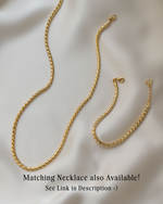 Gold chain necklace and vintage bracelet conveying there is a matching necklace and bracelet set available 