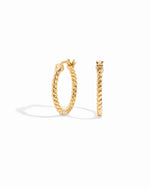 Closeup image of minimalist gold hoop earrings with spiral design