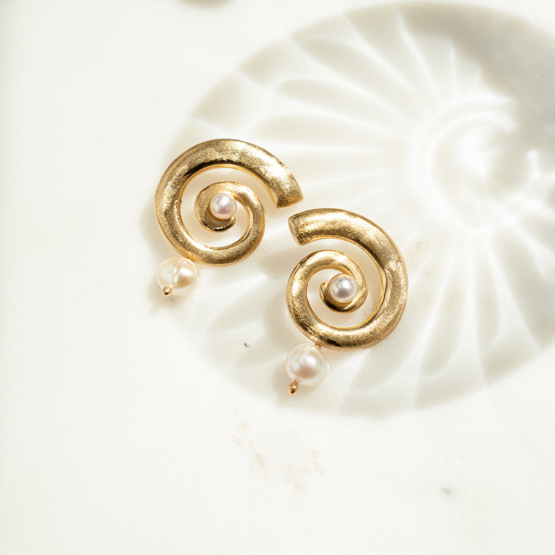 closeup image pf gold statement earrings