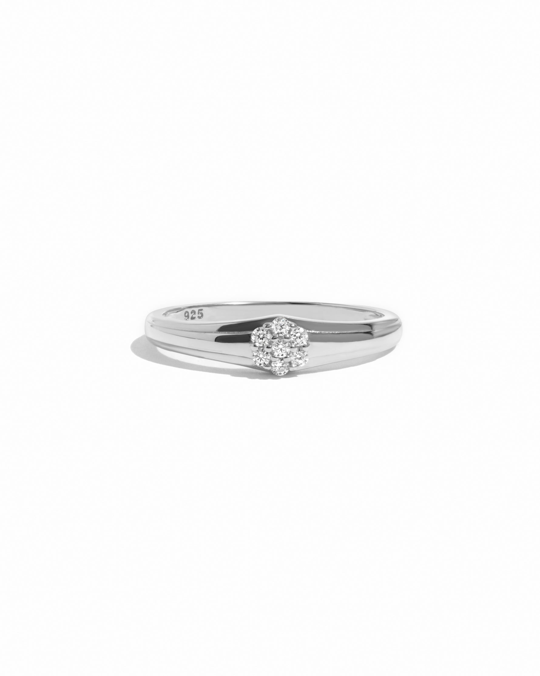 Silver ring with a cz diamond on a white background