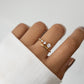 Sami Jewels 14k Gold Plated Bypass Ring with 5 Gradient CZ Stones on model's finger against a white background