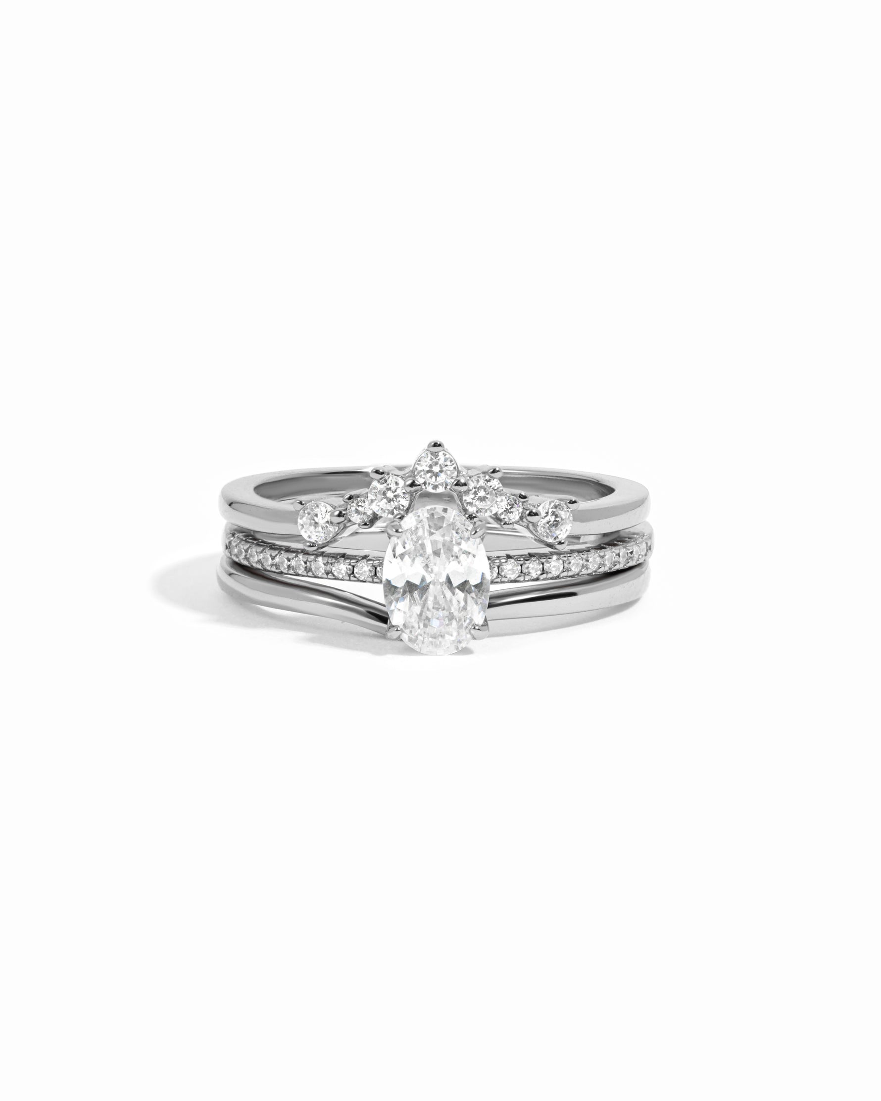Sterling silver bridal jewelry featuring a sterling silver engagement ring set on a white background