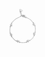 closeup image of silver star charm bracelet