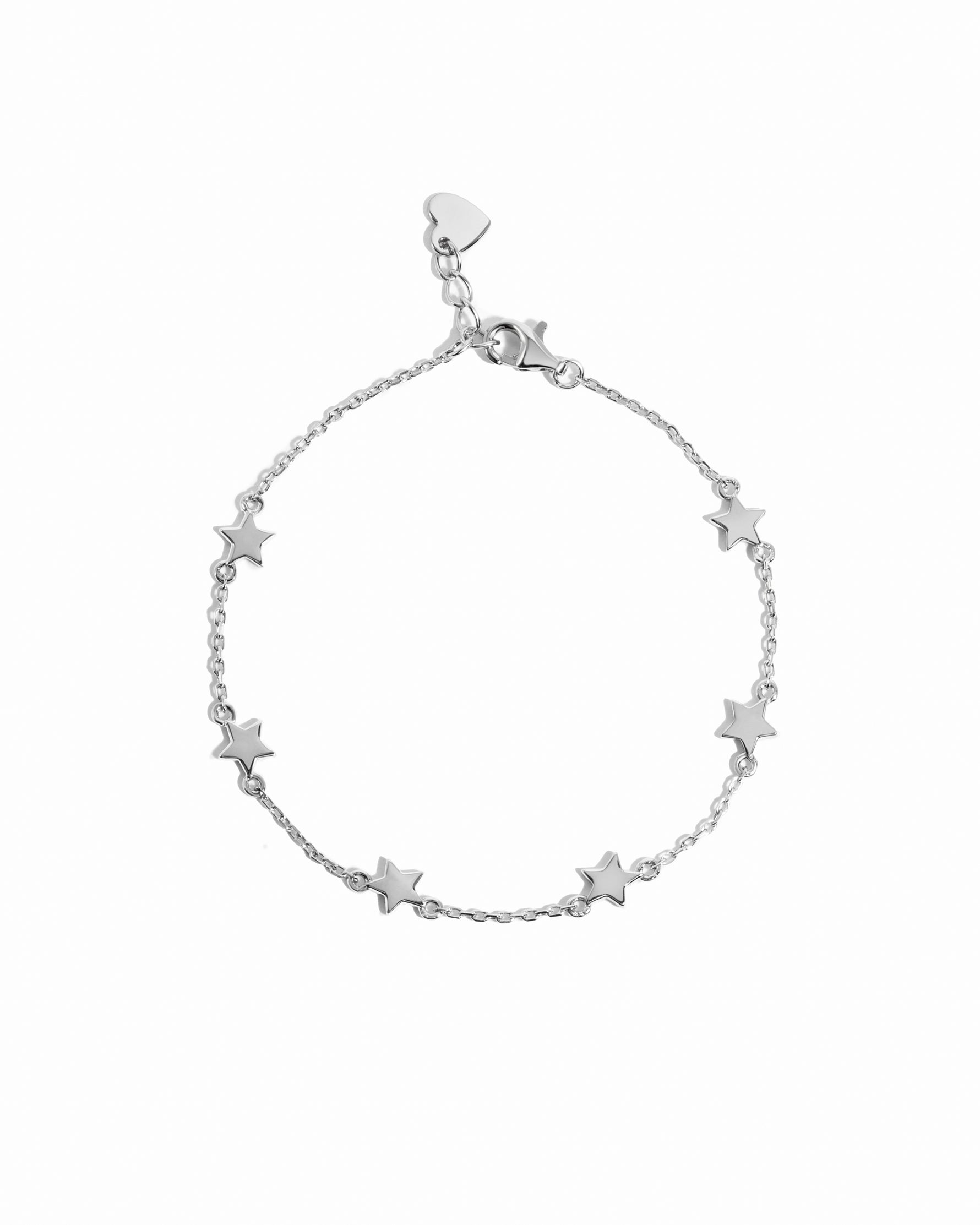 closeup image of silver star charm bracelet