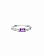 Sterling silver ring with a amethyst birthstone gemstone on a white background