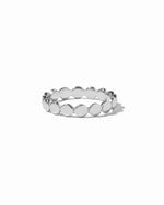 Silver ring with flat beaded design on a white background
