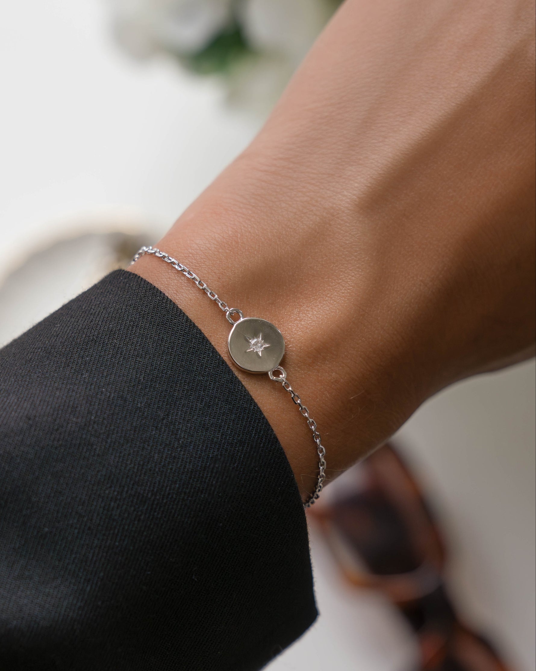 Dainty sterling silver chain bracelet on model
