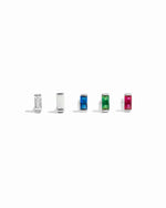Five small silver studs with different colored stones on a white background featuring white cz, opal, sapphire, emerald, and ruby