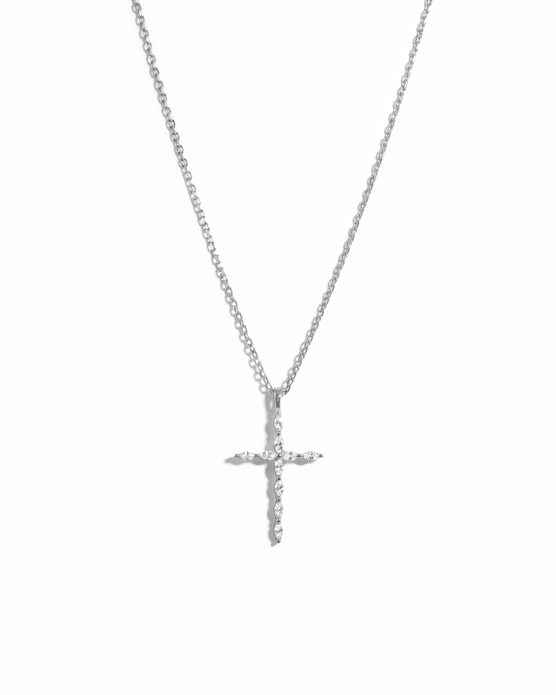 Sterling silver cross necklace on a white background