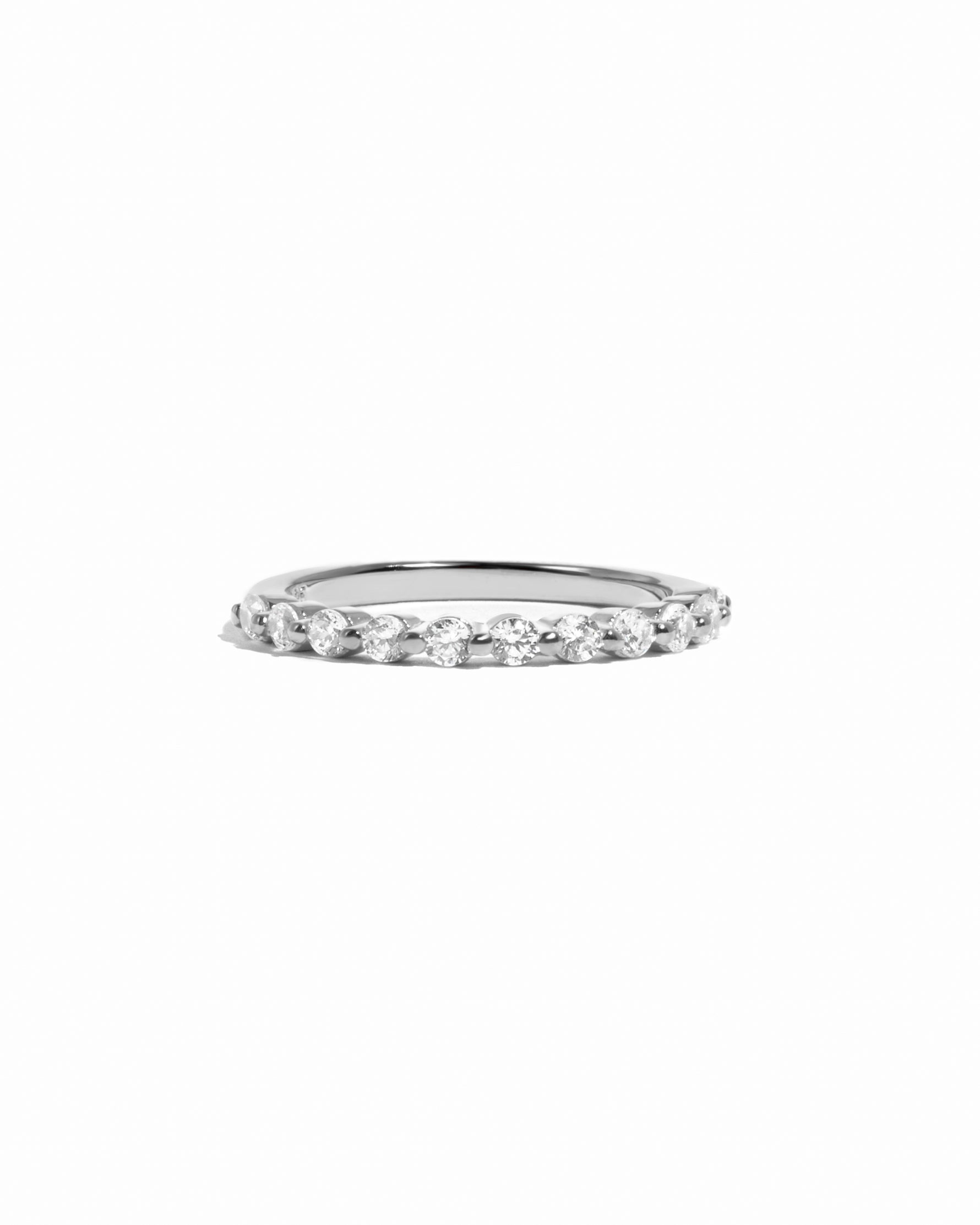 Sterling silver ring with cubic zirconia diamonds on a white background 