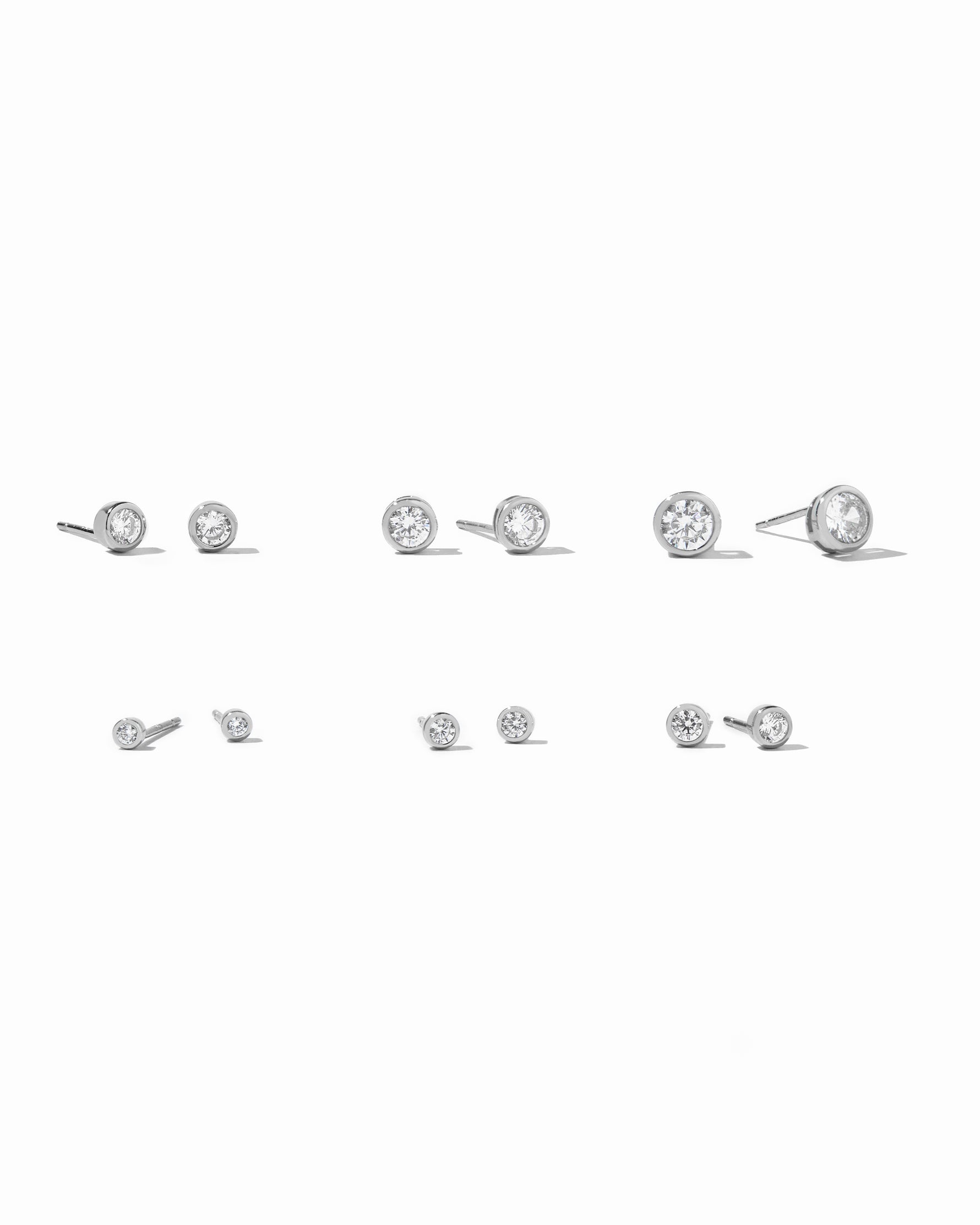 Sami Jewels 925 sterling silver tiny diamond bezel stud earrings on white background
