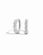 Pair of sterling silver diamond hoop earrings on a white background