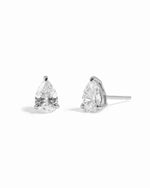 Sterling silver dainty diamond studs on a white background
