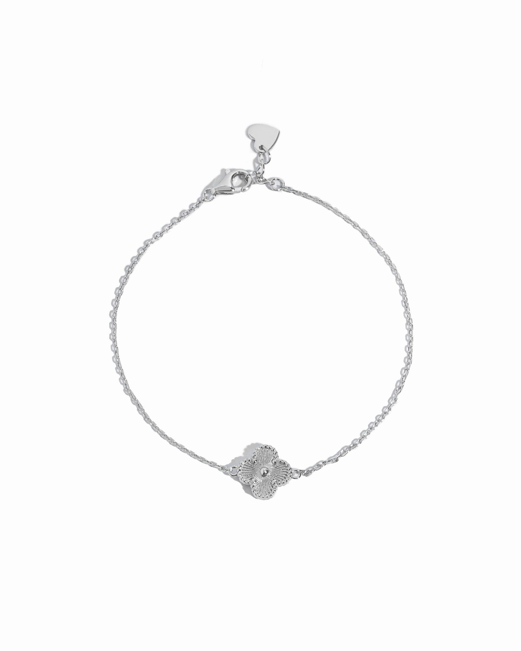 Sterling Silver chain bracelet with a detailed four leaf clover charm on a white background