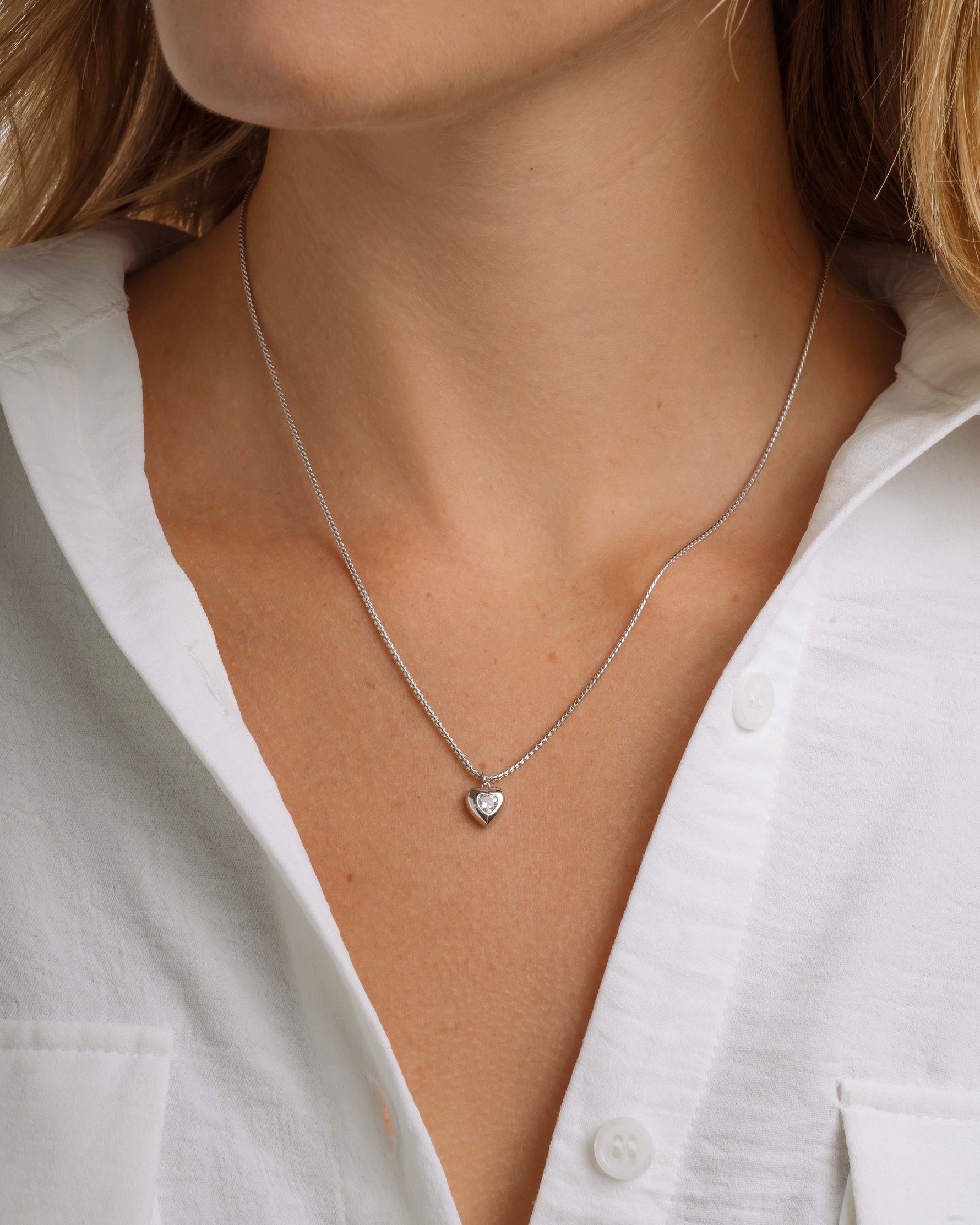 Model wearing silver chain layering necklace 