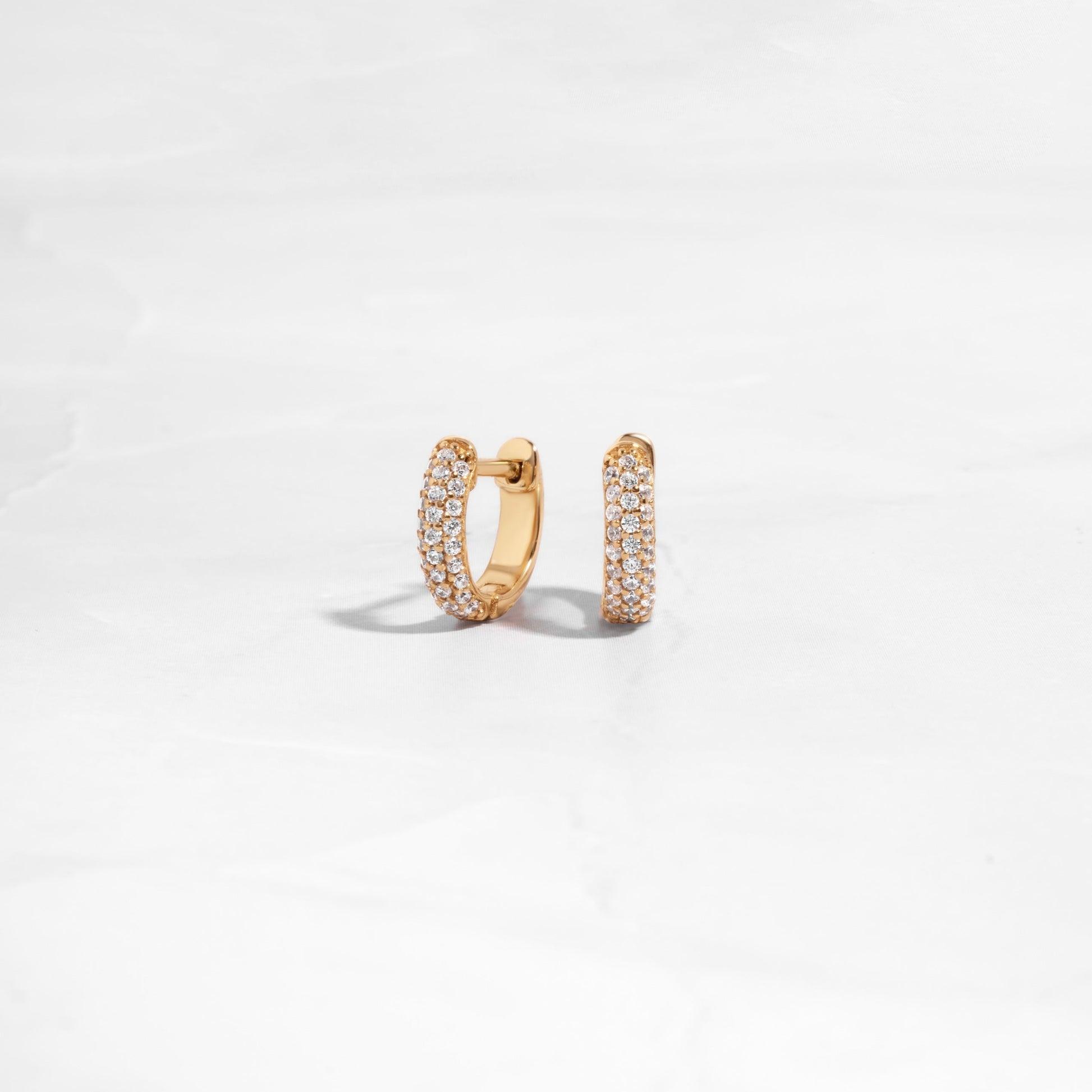 small hoop earrings featuring gold huggie hoop design 