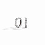 closeup image of sterling silver mini huggie hoop earrings