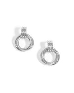 Flat lay of sterling silver hoop earrings, highlighting the fluid, curved knot detail.