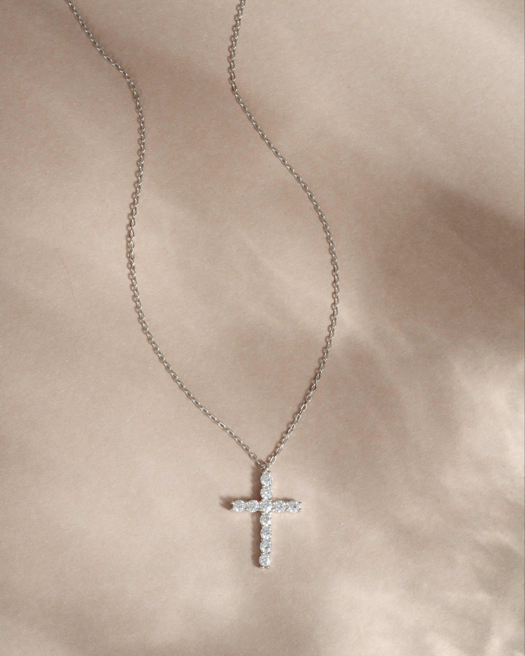 Sterling silver chain necklace with a dainty cross pendant
