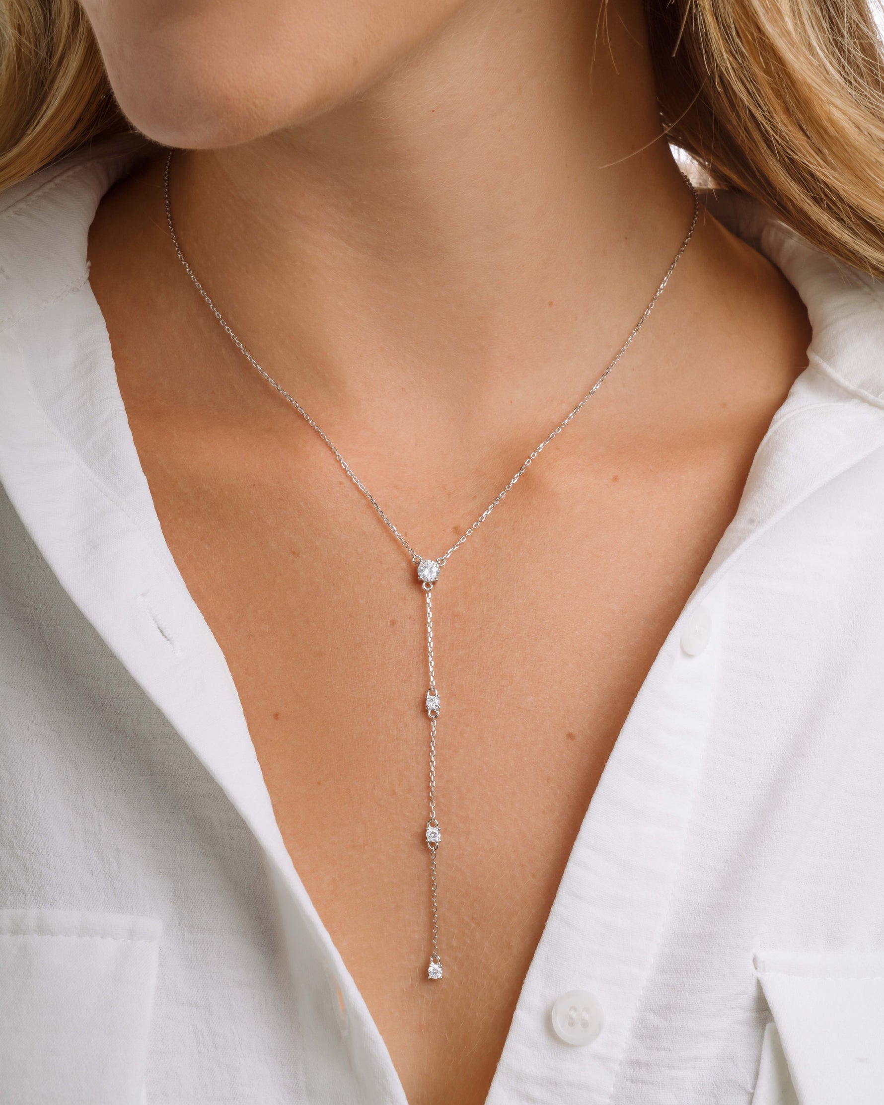 Sterling silver chain necklace with round solitaire diamond pendants