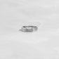 closeup image of silver marquise cut ring