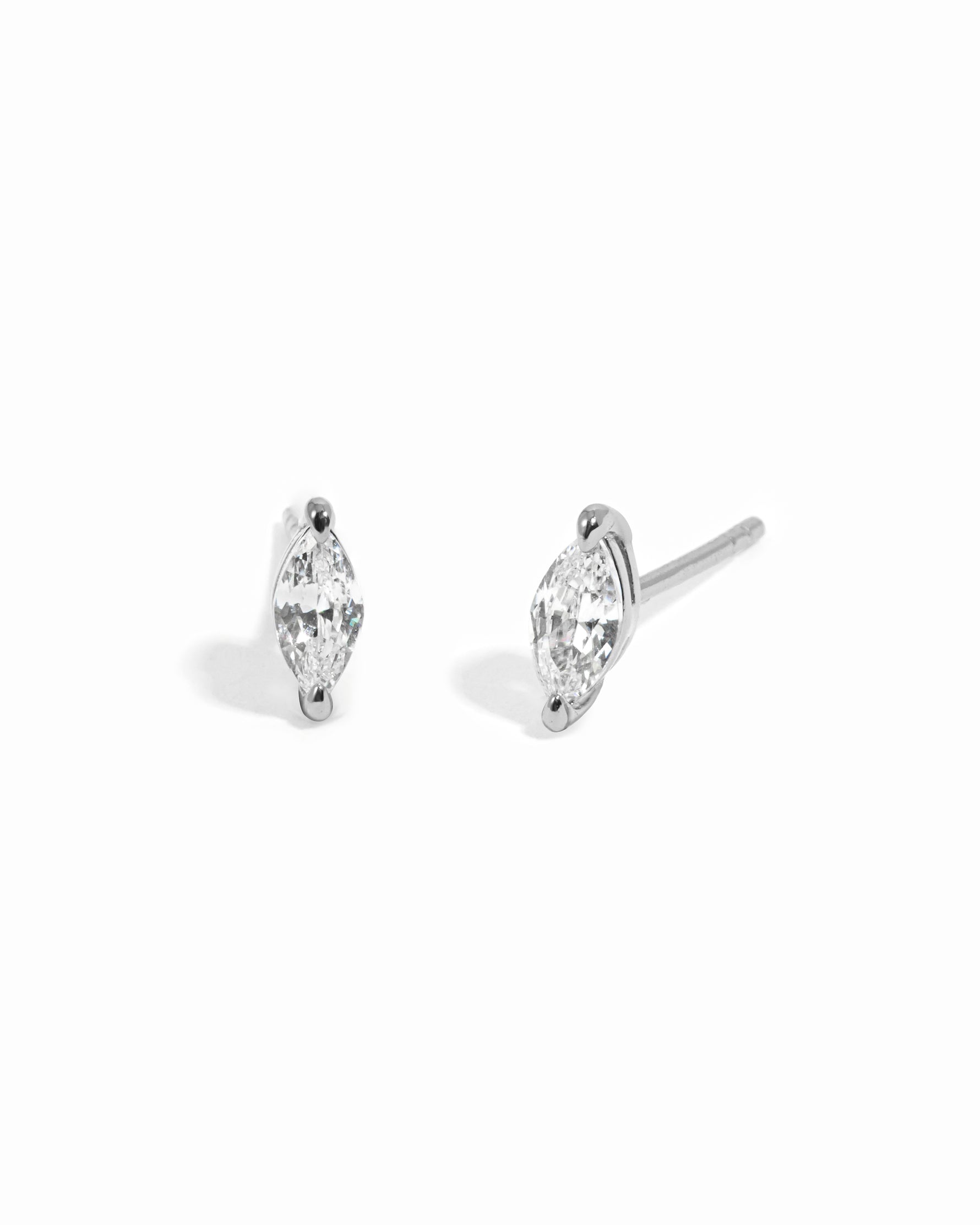 Sterling silver diamond earrings on a white background