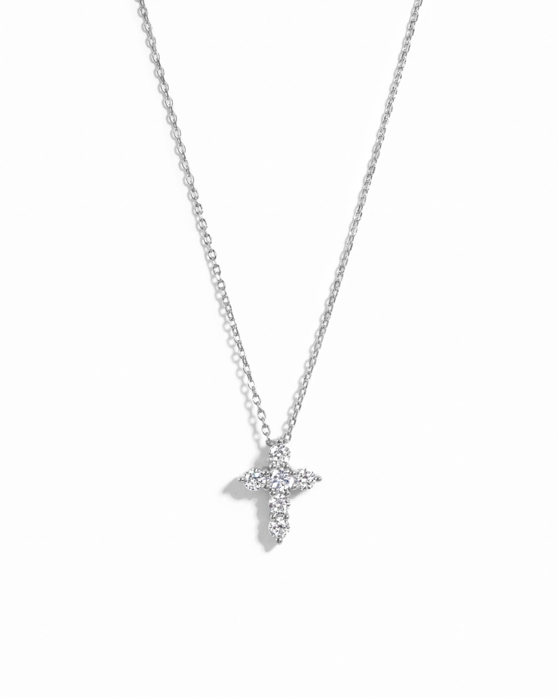 Sterling silver small diamond pendant necklace on a white background