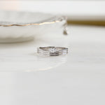 closeup image of silver stackable marquise ring