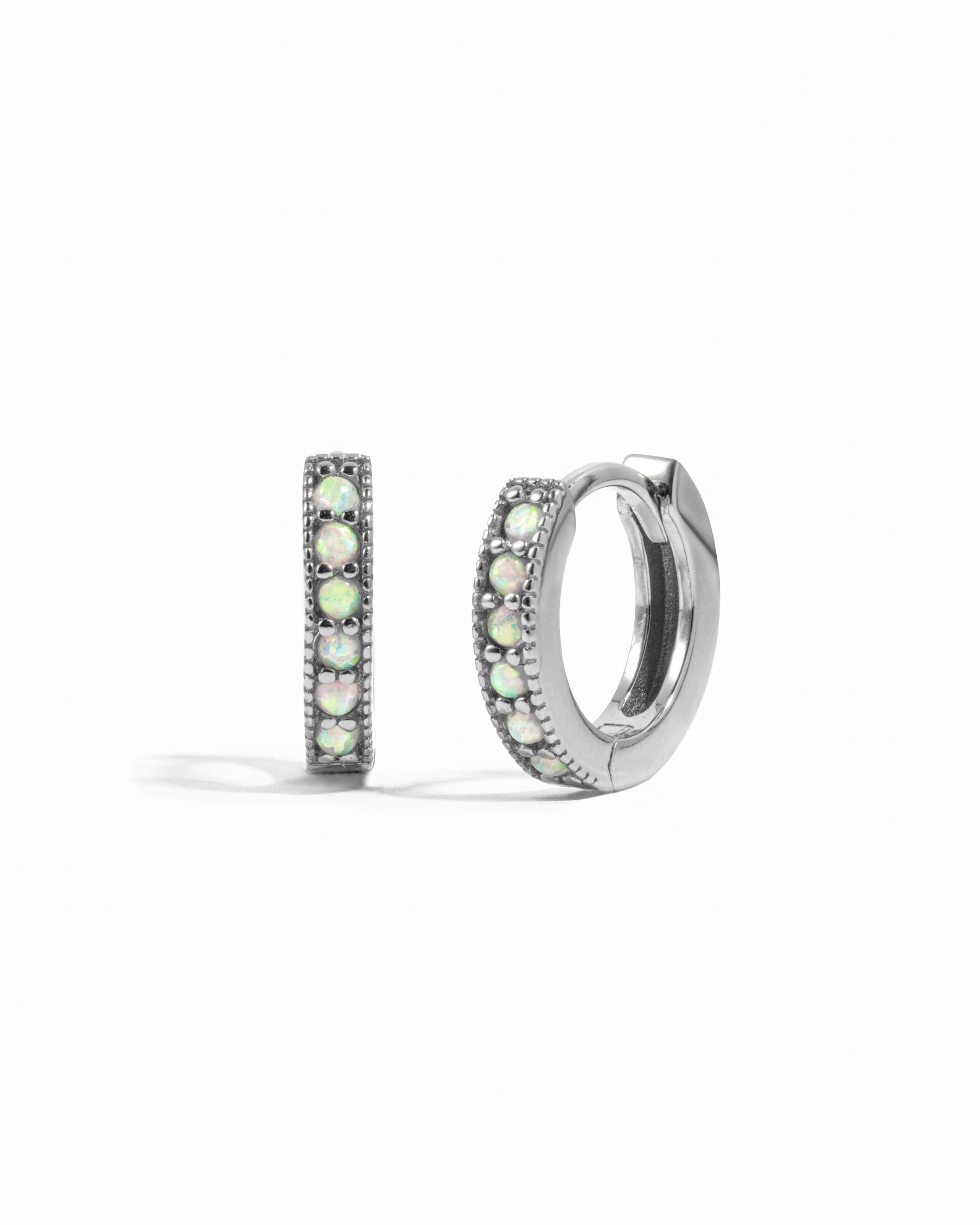 Sterling silver opal huggie hoop earrings.