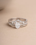 Sterling silver oval unique ring set on a beige background