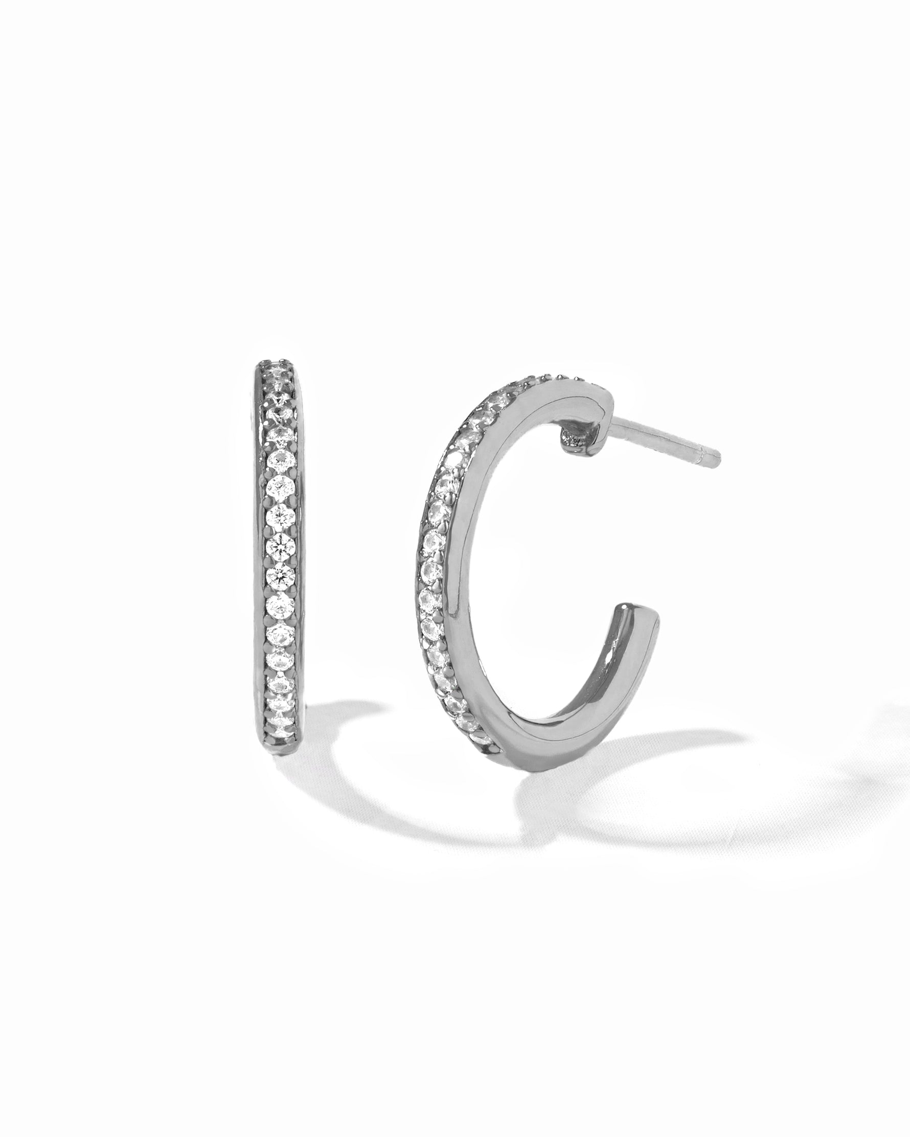 Sterling silver diamond hoop earrings.