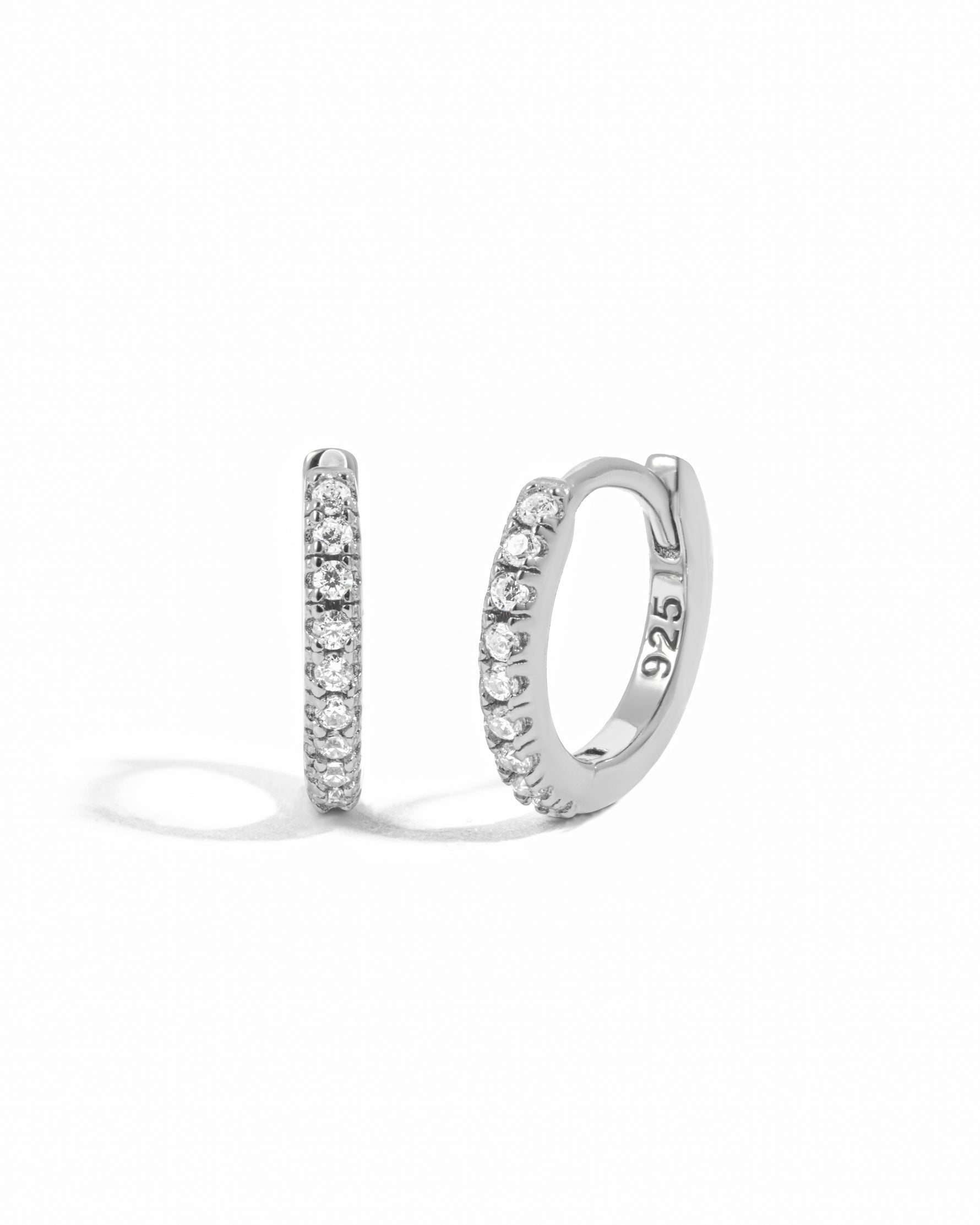 Sterling silver pavé huggie hoops.