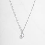 Closeup image of opal necklace in silver