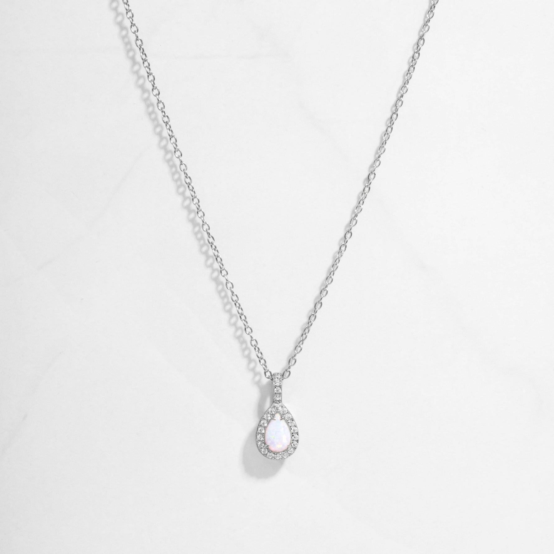 Closeup image of opal necklace in silver