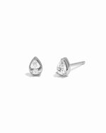 Pair of silver teardrop-shaped stud earrings on a white background