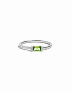 Sterling silver peridot simple baguette ring on a white background