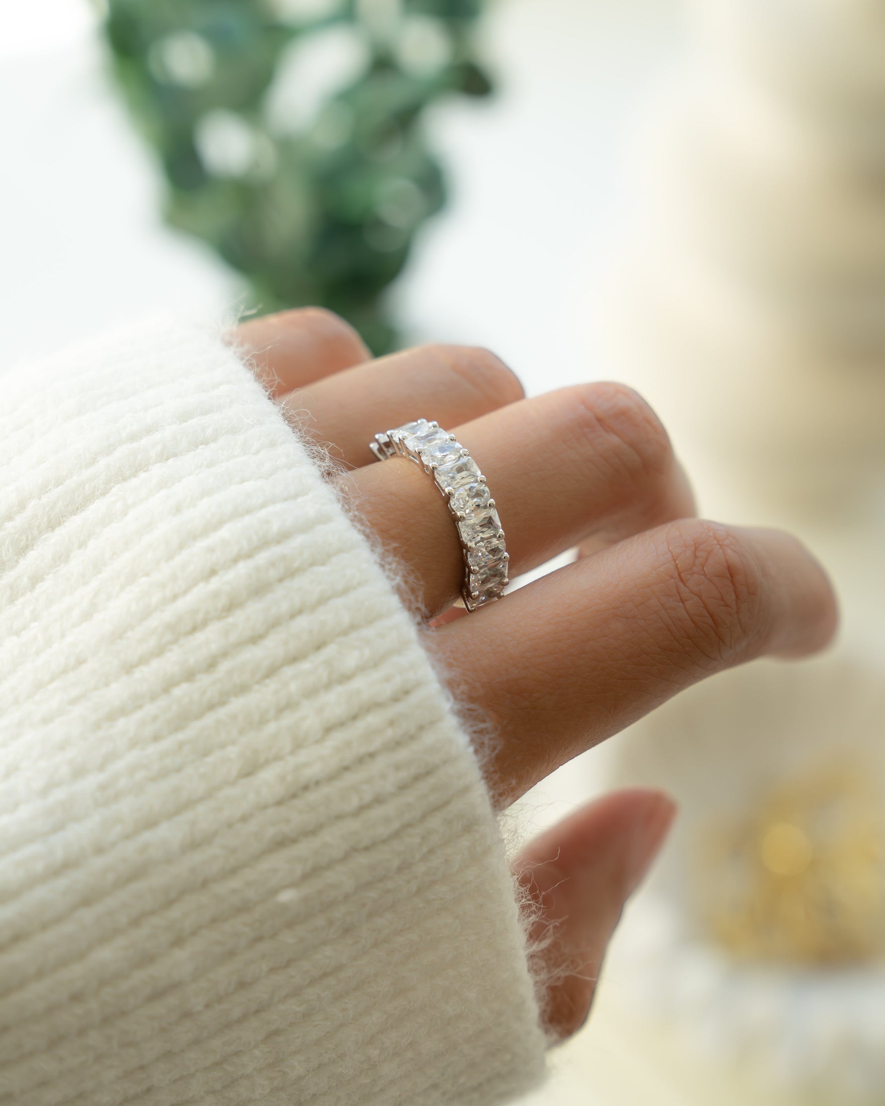 Sterling silver half eternity emerald cut promise ring on model