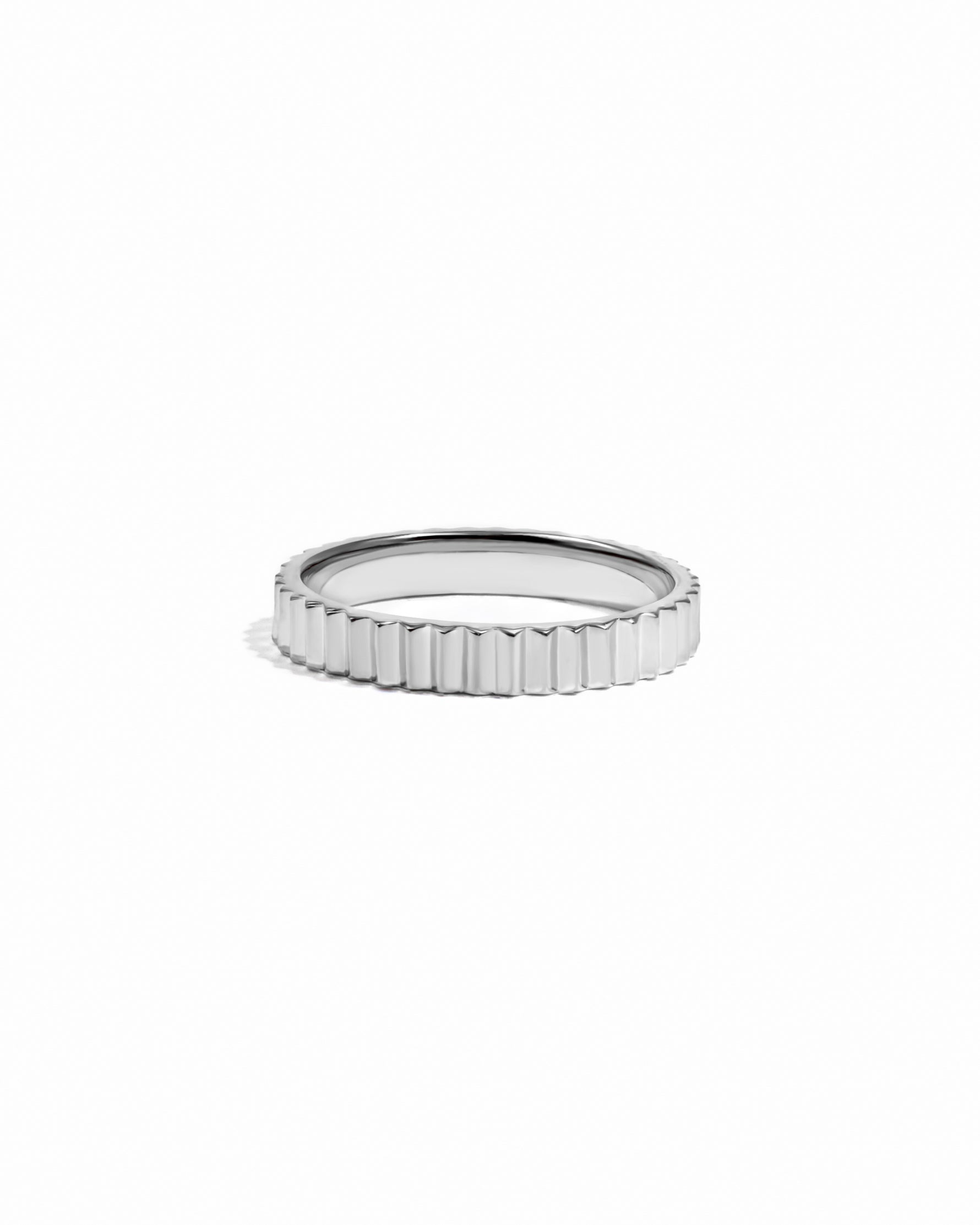 Sterling silver ridged stacking ring band on white background.