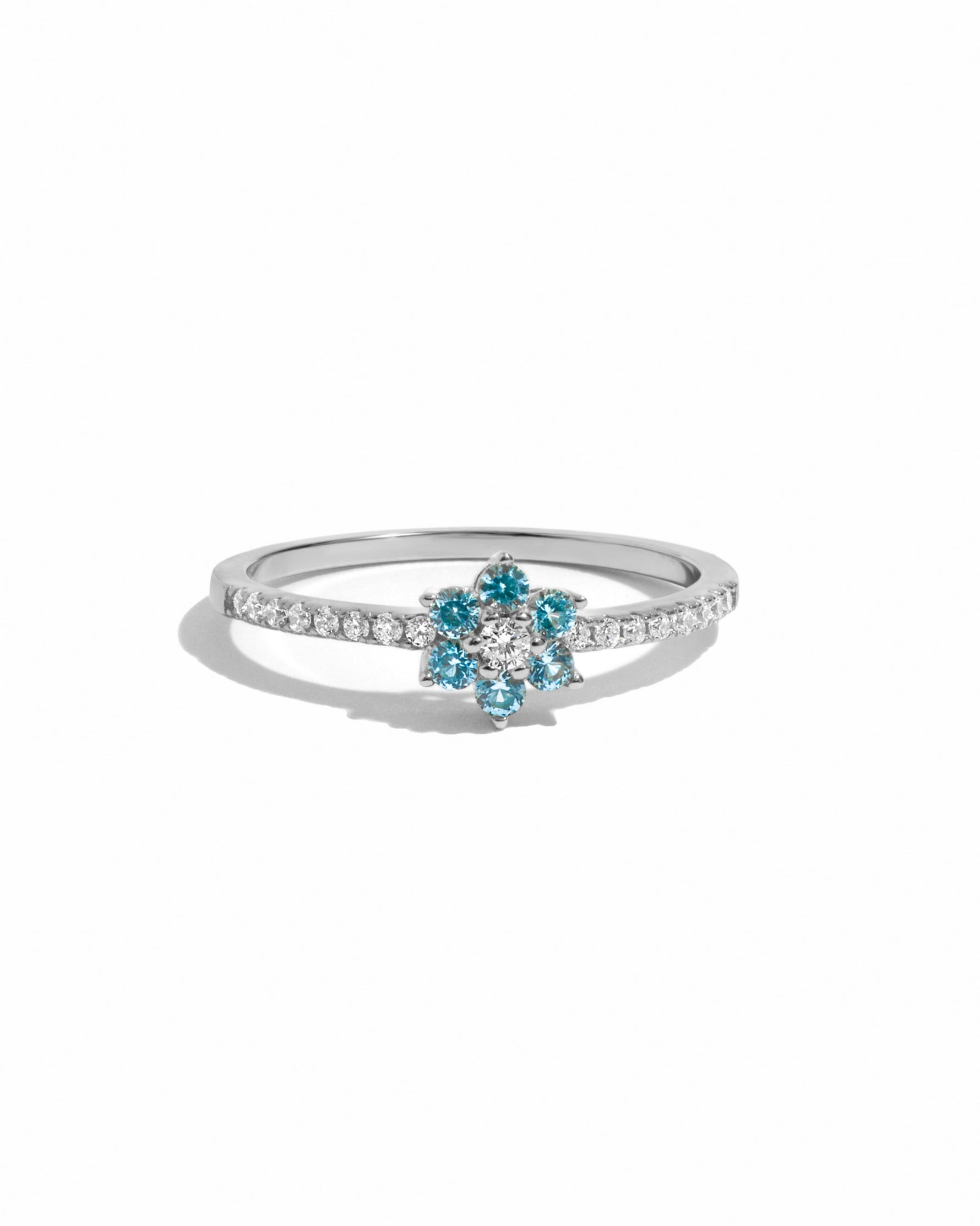 sterling silver aqua flower ring on a white background