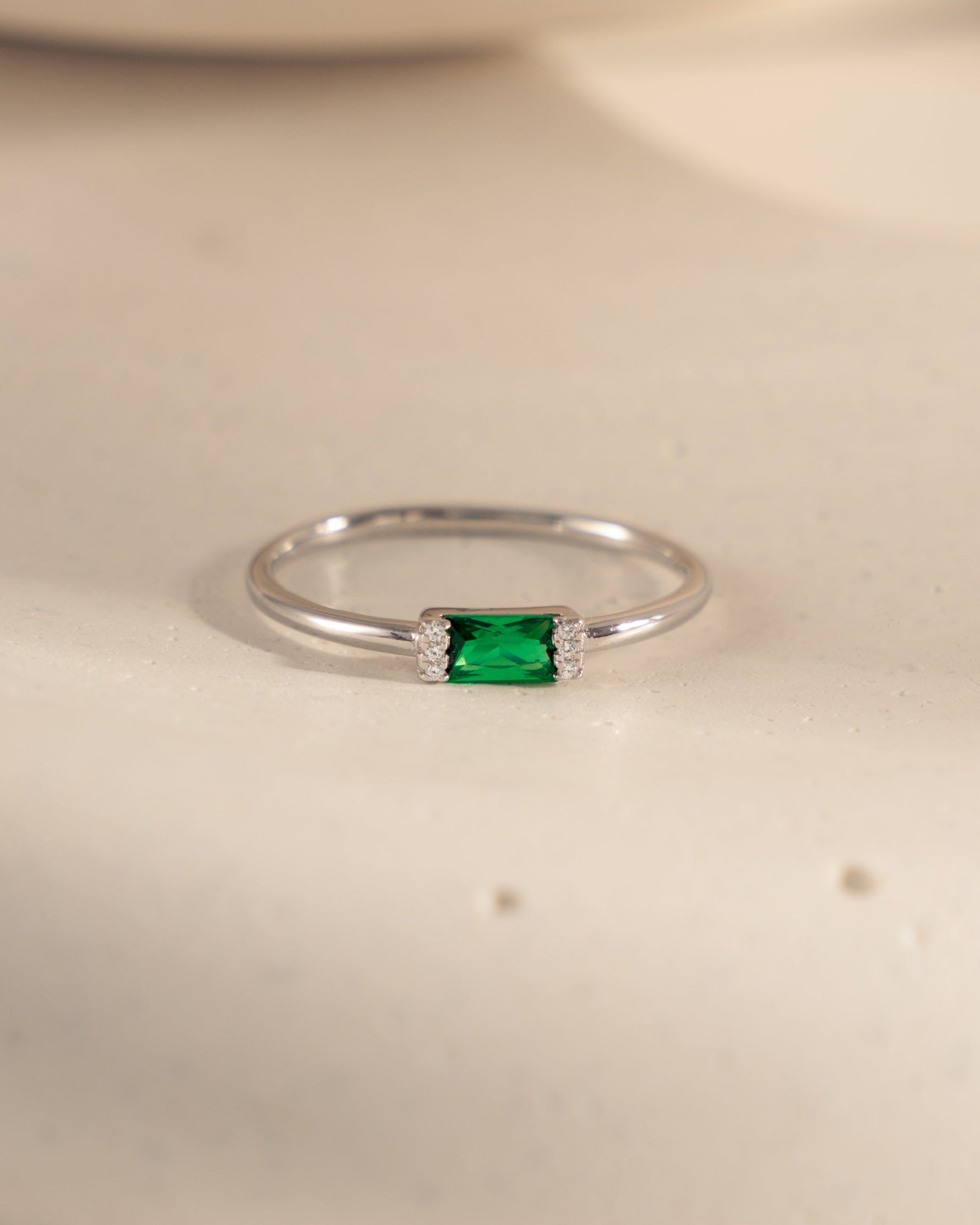 sterling silver cz ring with emerald stone and white cz diamonds