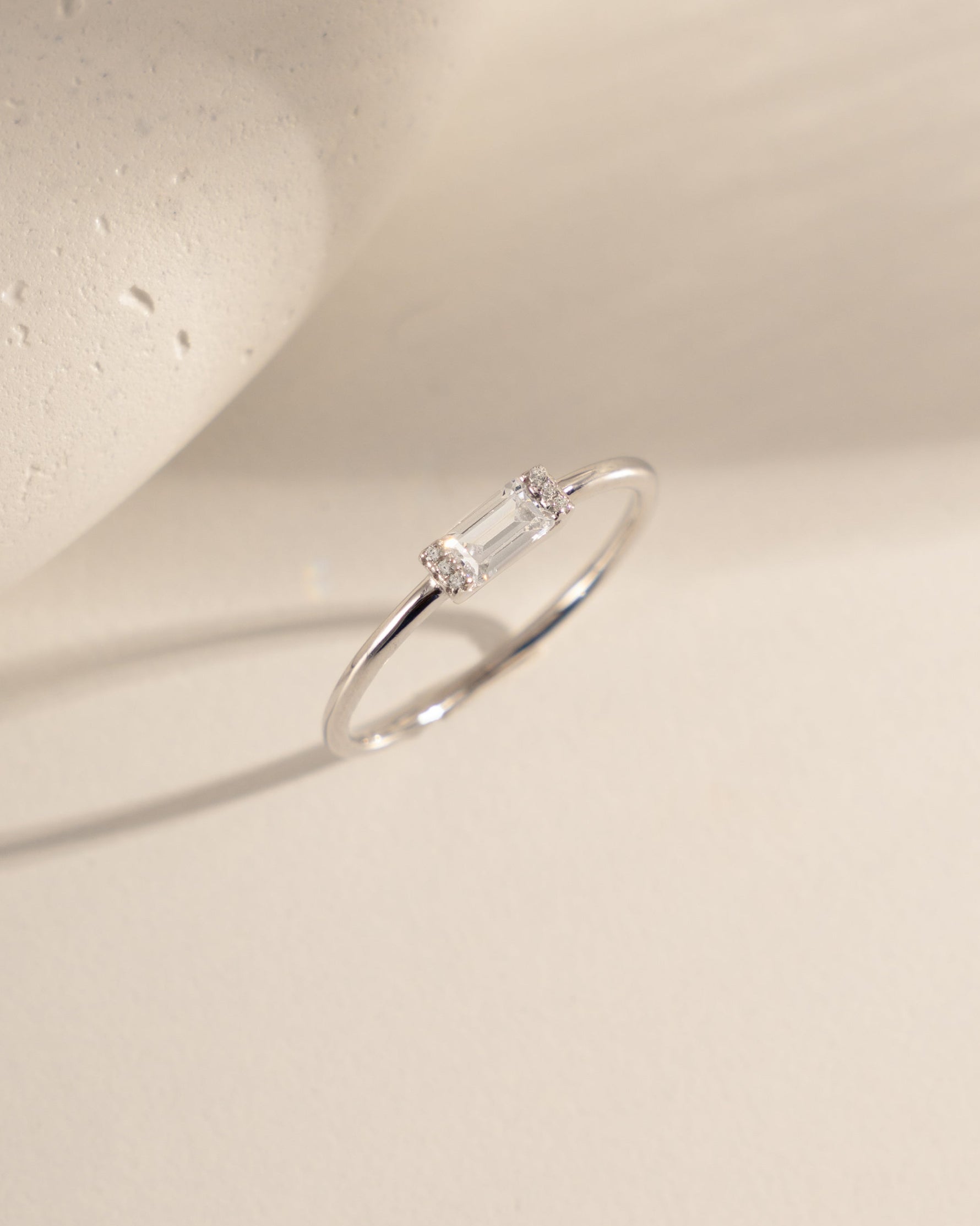 closeup image of simple baguette stone on a sterling silver band