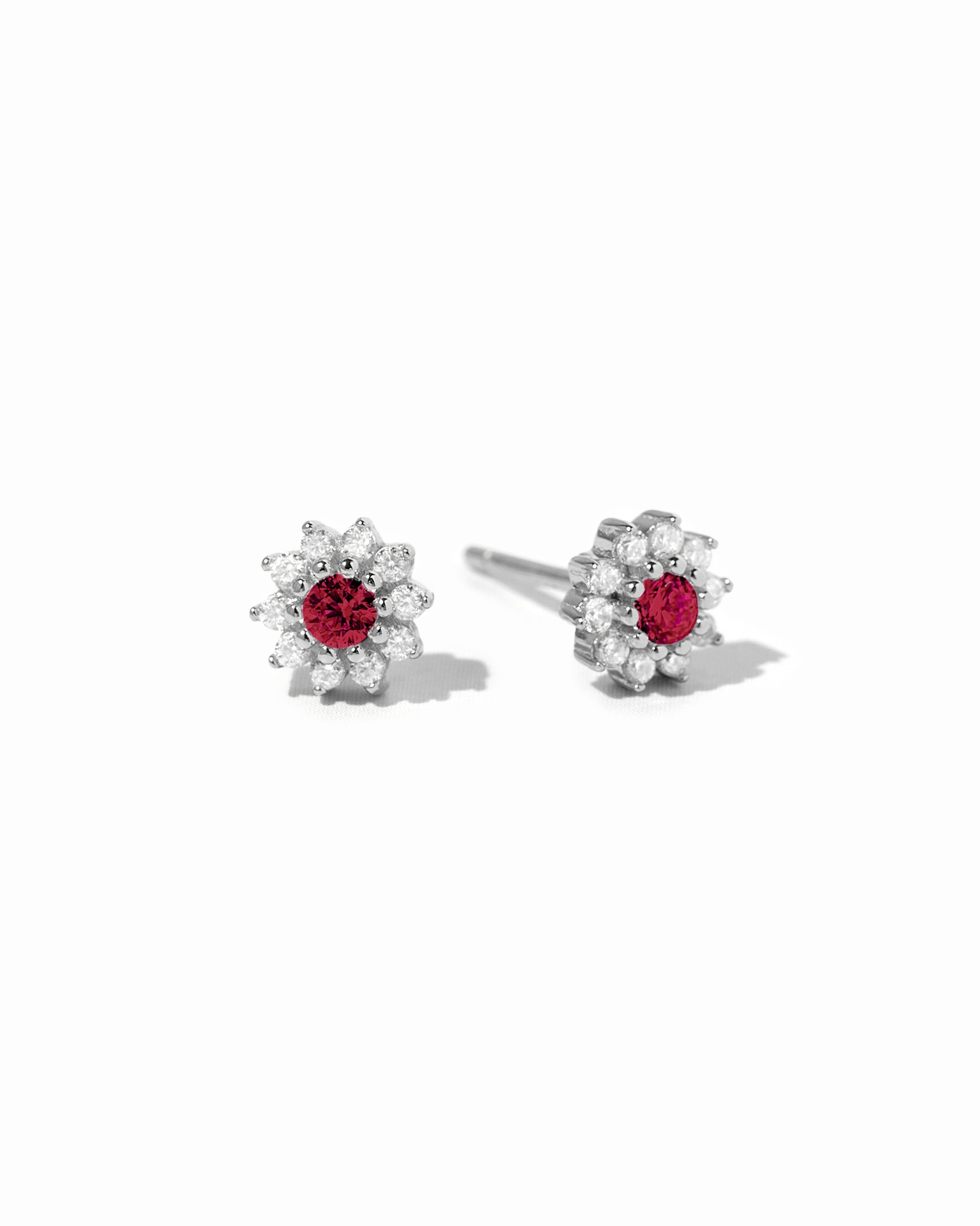 sterling silver ruby flower stud earrings.