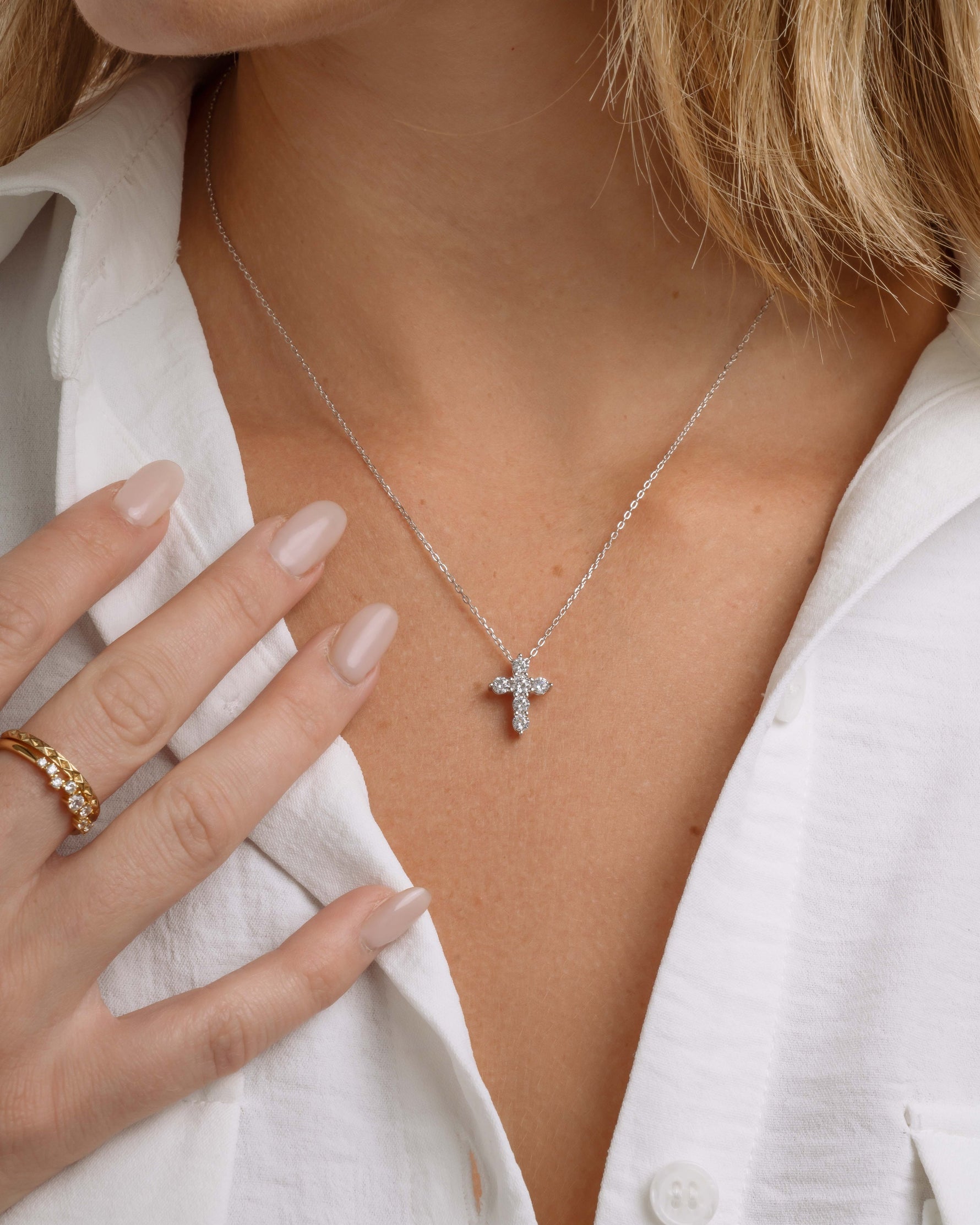 Sterling silver diamond cross pendant on a  model