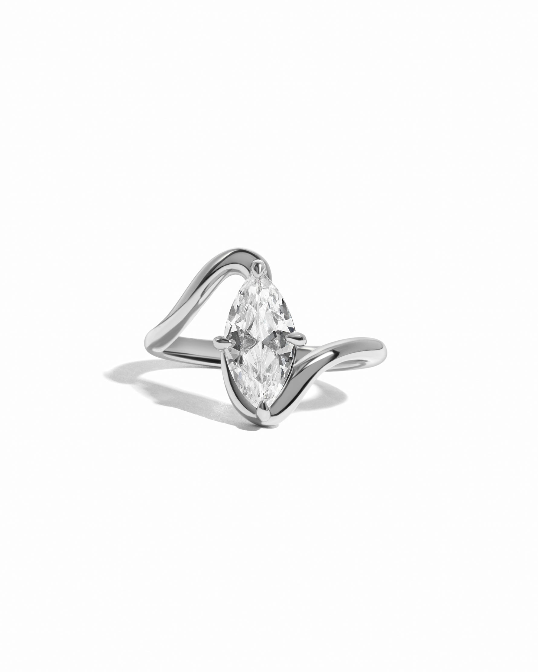 Sterling silver marquise diamond bypass ring on white background 