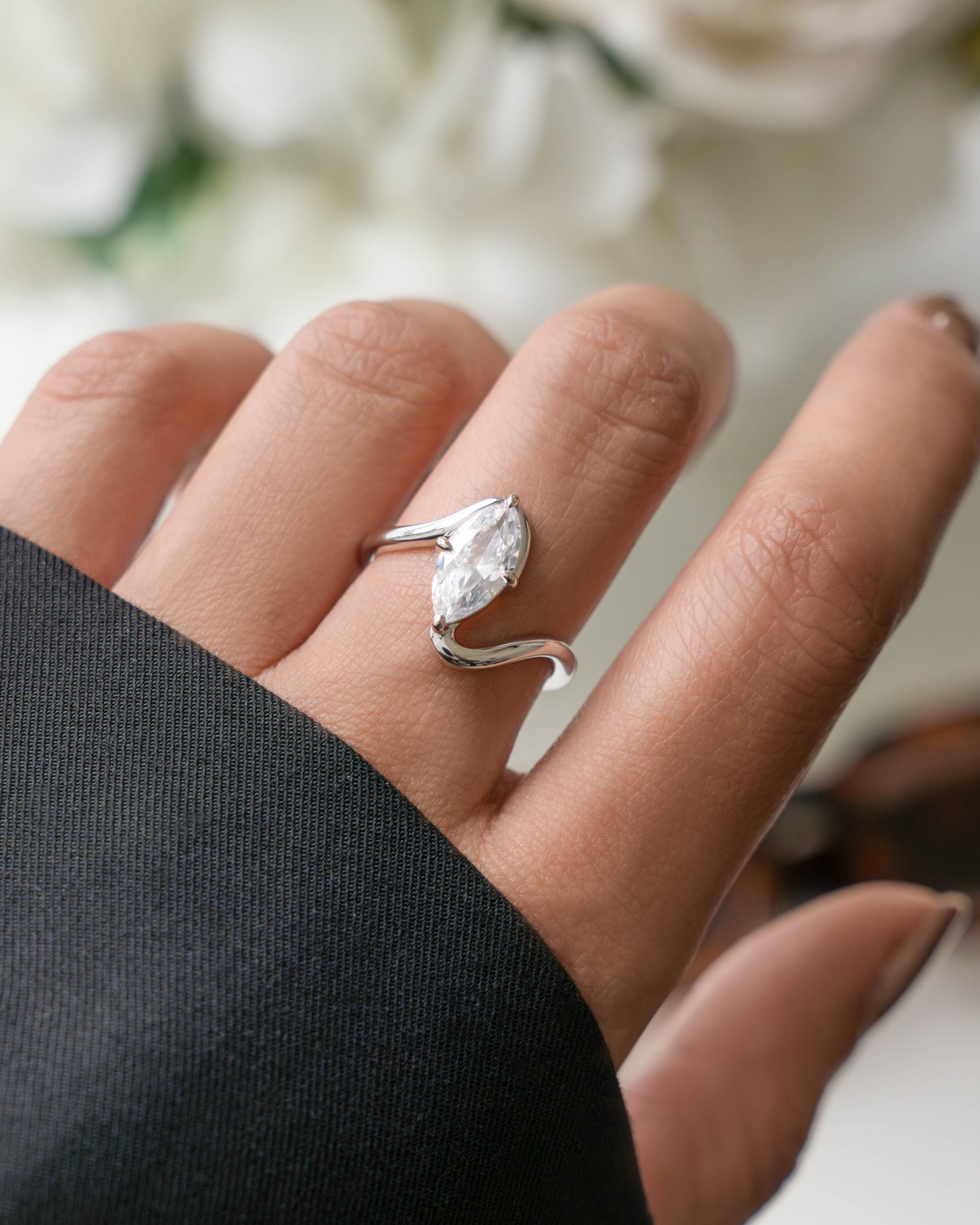 silver vintage ring with marquise diamond on models hand 