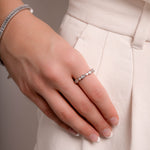 Model wearing sterling silver ring with diamond band