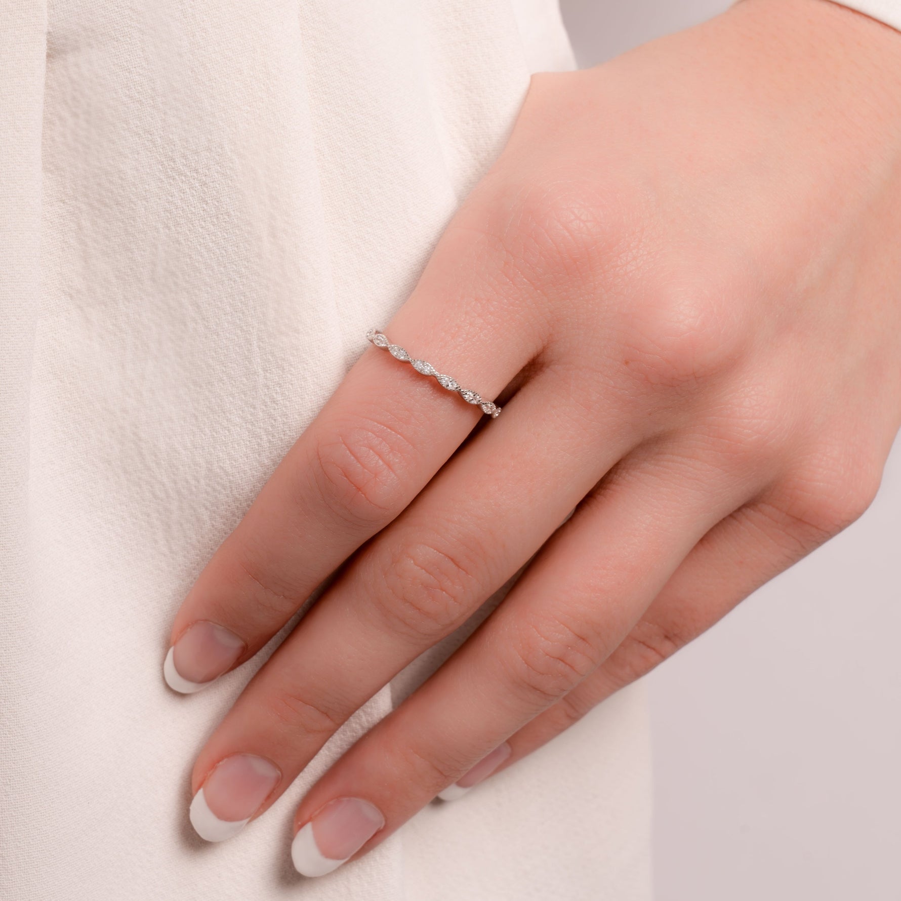 Model wearing sterling silver dainty diamond ring