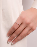 Sterling silver diamond stacking ring by Sami Jewels with thin, dainty design and sparkling diamonds on a white background.