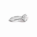 side view of silver pearl and pear cut cz ring